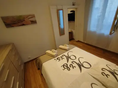 a bedroom with a bed with two towels on it at Appartement 2 pièces rénover in Nice