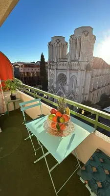 a bowl of fruit on a table on a balcony at Studio NICE CENTRE sur Avenue Jean Medecin MER à 8 minutes de marche in Nice