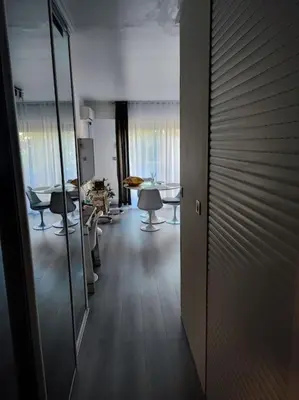 a hallway with chairs and a table in a room at Studio 31 m² in Nice