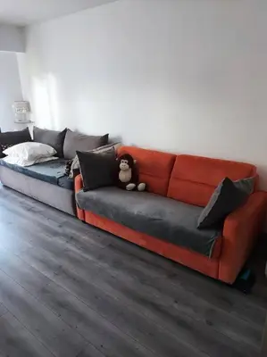 a couch with a teddy bear sitting on top of it at Studio 31 m² in Nice
