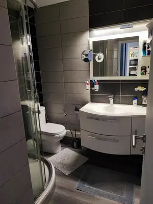 a bathroom with a toilet and a sink and a shower at Studio 31 m² in Nice