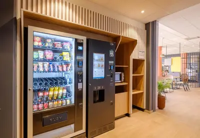 a vending machine in a room with drinks at B&B HOTEL Nice Stade Riviera in Nice