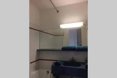 a bathroom with a sink and a mirror at Pool , 150m to beach, seaview in Villefranche-sur-Mer