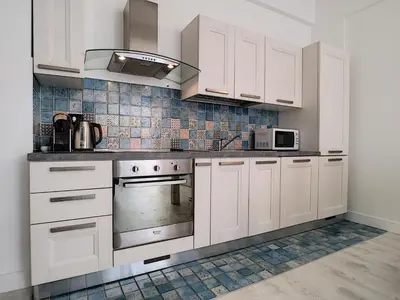 a kitchen with white cabinets and a stove top oven at Nestor&Jeeves - BEACH ROYAL - Central, Close sea in Nice