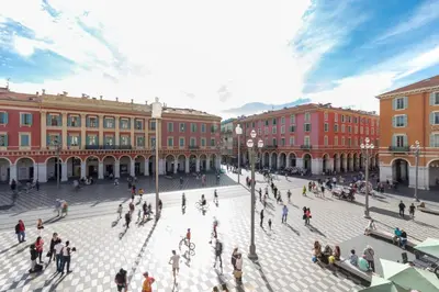 a group of people walking around a plaza in a city at Nestor&Jeeves - BEACH ROYAL - Central, Close sea in Nice