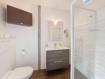 a bathroom with a toilet and a sink and a shower at Nestor&Jeeves - DOLCE VITA MASTER - Jean Medecin in Nice