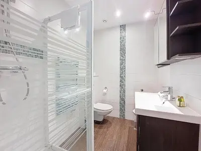 a white bathroom with a toilet and a sink at Nestor&Jeeves - DOLCE VITA MASTER - Jean Medecin in Nice