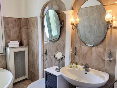 a bathroom with a sink and a mirror at Nestor&Jeeves - CHILL LOUNGE - City center, close sea in Nice