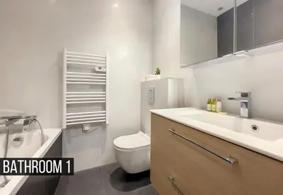 a bathroom with a white toilet and a sink at Nestor&Jeeves - MADAGASCAR - 3 chambres, Centre-ville in Nice