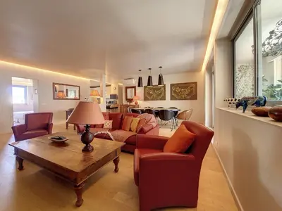 a living room with a couch and chairs and a table at Nestor&Jeeves - FLEURS TERRASSE - 3 chambres in Nice
