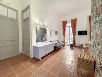 a living room with a couch and a table at Nestor&Jeeves - TERRACOTTA - Premium location, close sea in Nice