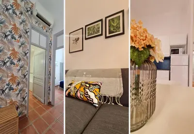 a room with a table and a vase with flowers at Nestor&Jeeves - TERRACOTTA - Premium location, close sea in Nice