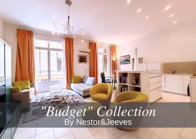 a living room with a couch and a table at Nestor&Jeeves - FRENCHY - Hyper center, Closer sea and Place Massena in Nice