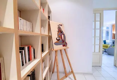 a ladder leaning against a book shelf with books at Nestor&Jeeves - FRENCHY - Hyper center, Closer sea and Place Massena in Nice