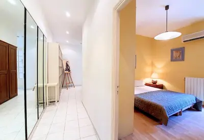a bedroom with a bed and a glass corridor at Nestor&Jeeves - FRENCHY - Hyper center, Closer sea and Place Massena in Nice