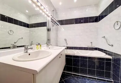 a bathroom with a sink and a bath tub at Nestor&Jeeves - FRENCHY - Hyper center, Closer sea and Place Massena in Nice