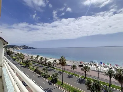 a view of the beach from a balcony of a building at Nestor&Jeeves - MEDITERRANEE PROMENADE - Vue Mer in Nice