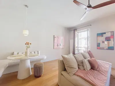 a living room with a couch and a ceiling fan at Nestor&Jeeves - RIVIERA - Central - Near Beach in Nice