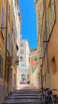 an alley between two buildings with bikes parked on it at Charmant deux pièces dans le quartier du Port in Nice