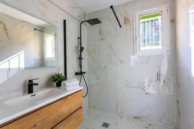 a bathroom with a sink and a shower at LE MONT ALBAN AP4360 By Riviera Holiday Homes in Villefranche-sur-Mer