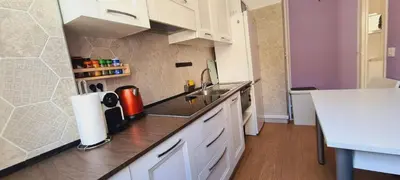 a kitchen with a sink and a counter top at Gloria apartments in Nice