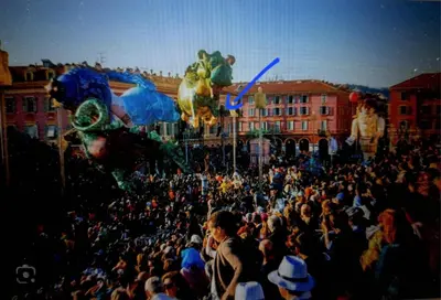 a crowd of people watching a parade with balloons at Massena square View 2 min to the beach & the old town in Nice
