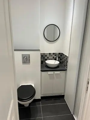 a small bathroom with a toilet and a sink at Escapades Ensoleillées in Nice