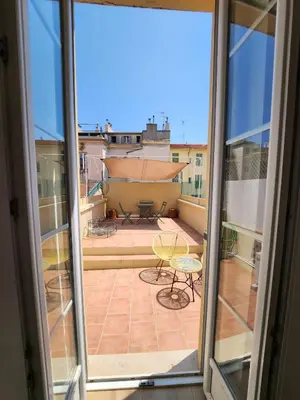 a view from an open window of a patio at AMAZING STUDIO - GRANDE TERRASSE - COEUR DE VILLE - WIFI - AC in Nice