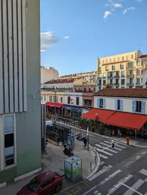 a view of a city street with a red car at Holiday Nice Studio in Nice