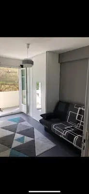 a bedroom with a bed and a large window at Chez Nico in Nice
