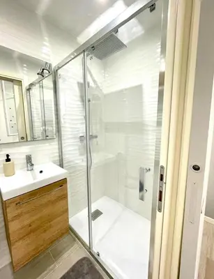 a bathroom with a shower and a sink at Congrès Résidence in Nice
