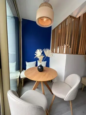 a dining room with a table and two chairs at Riviera 1 ou Riviera 2 ou réservez les 2 Front de Mer Cagnes sur Mer Promenade de la plage in Cagnes-sur-Mer