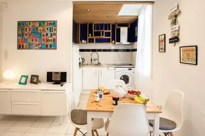 a kitchen and dining room with a table and chairs at 26 nice Vieux Nice in Nice