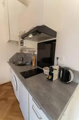 a kitchen with a sink and a counter top at NICE CENTRE-VILLE STUDIO en étage in Nice