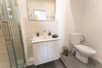 a bathroom with a toilet and a sink and a shower at NICE Centre-ville Studio en étage refait à neuf in Nice