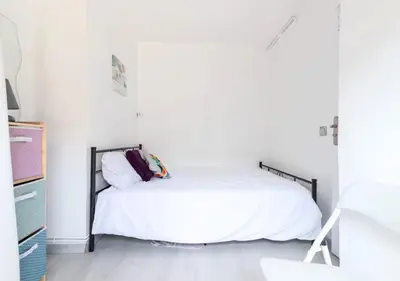 a living room with a table and chairs and a couch at Beautiful & spacious 2 bed Apt near Nice Center in Nice