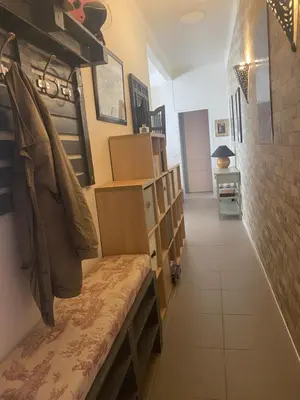 a room with bookshelves and a bench in a room at appartement cosy in Nice