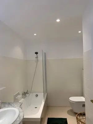 a bathroom with a shower and a toilet and a sink at Cozy Beachside Apartment in Cros de Cagnes - Luna in Cagnes-sur-Mer