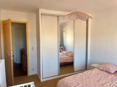 a mirror in a bedroom with a bed and a bed at Triplex Toit-Terrasse Authentique Vieux-Nice & Mer in Nice