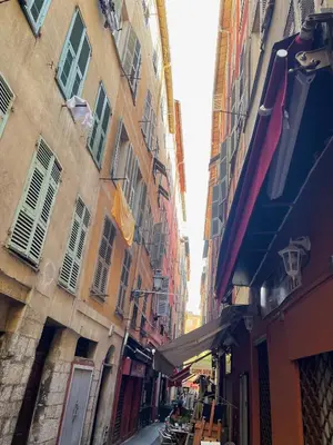 an alley between two buildings in a city at Triplex Toit-Terrasse Authentique Vieux-Nice & Mer in Nice