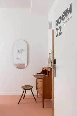 an office with a desk and a mirror at SLO Hostel Nice in Nice
