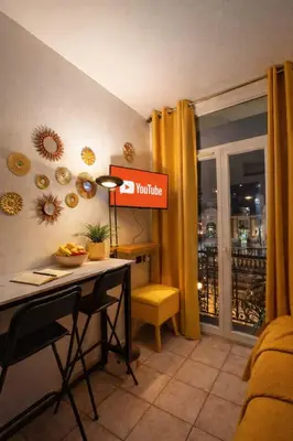 a coffee maker sitting on a red plate with a cup at Magnifique studio centre-ville in Nice