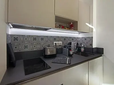 a kitchen with a counter top with a coffee maker at Superbe 2 pièces Carré d’or avec grande Terrasse in Nice