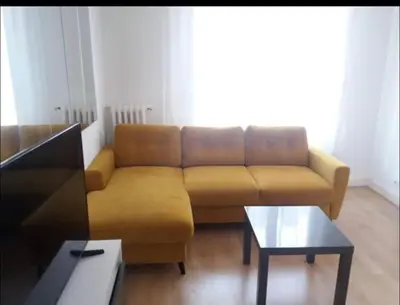 a living room with a couch and a coffee table at En plein coeur de Nice in Nice