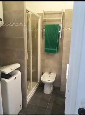 a bathroom with a toilet and a shower and a sink at En plein coeur de Nice in Nice
