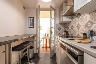 a kitchen with a counter and a counter top at MY CASA - MALONAT - Cosy Apart in Old Town w AC in Nice