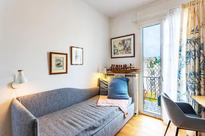 a living room with a couch and a window at LE FRANCE AP4350 By Riviera Holiday Homes in Nice