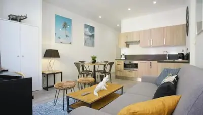 a bedroom with a bed with two towels on it at Appartement coeur du vieux Nice in Nice