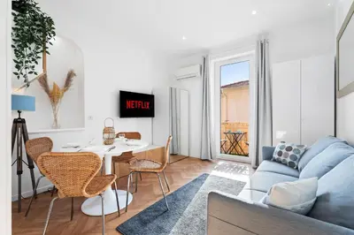 a living room with a blue couch and a table at Nice Renting - MAETERLINCK - Idyllic Luxury Retreat in Cap de Nice Sea View in Nice