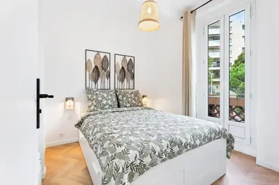 a white bedroom with a large bed in it at Nice Renting - MAETERLINCK - Idyllic Luxury Retreat in Cap de Nice Sea View in Nice